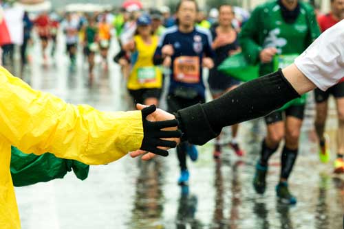 marathoners running in the rain